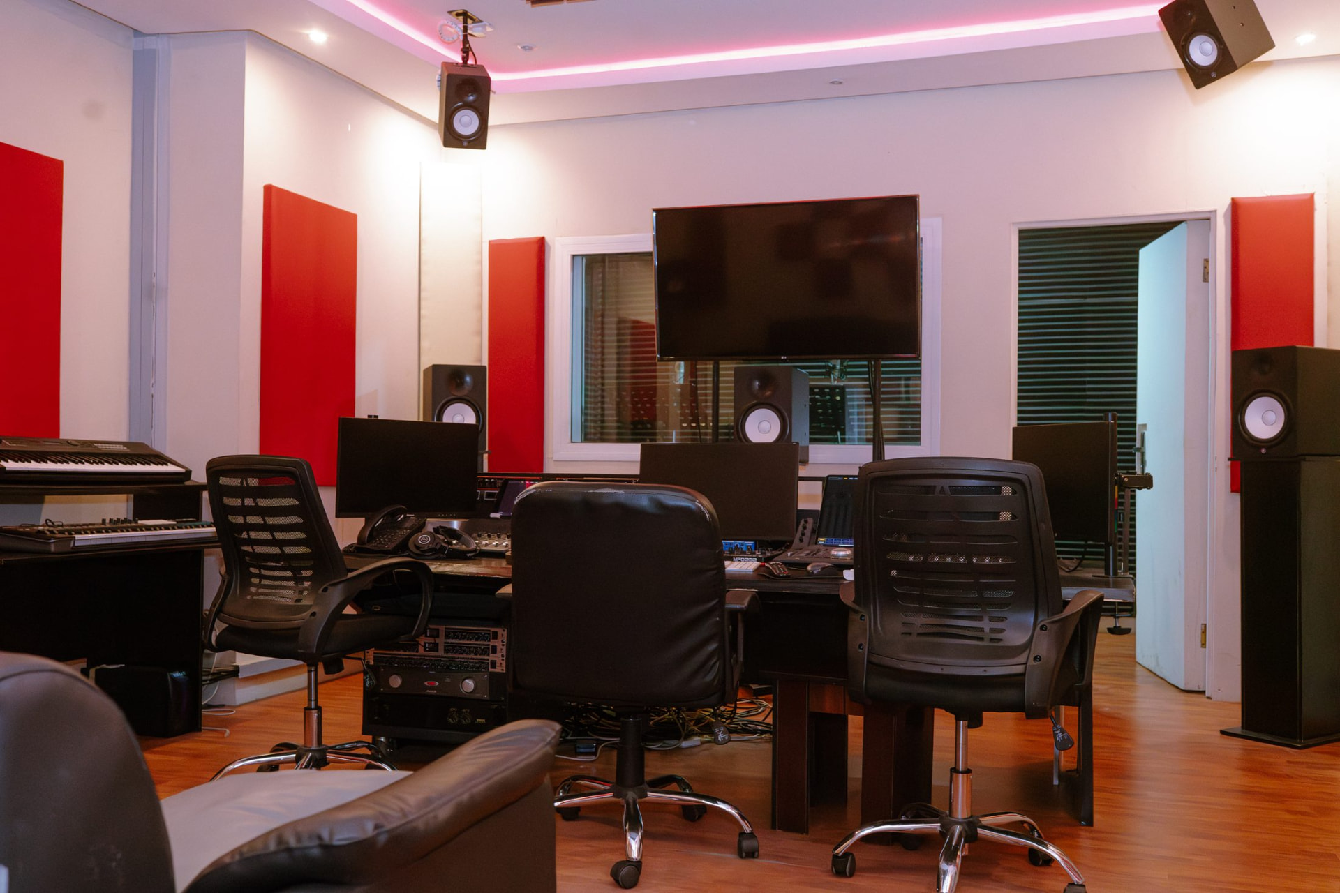 Digitrack's red-panelled mix room with keyboard, console and monitor stack